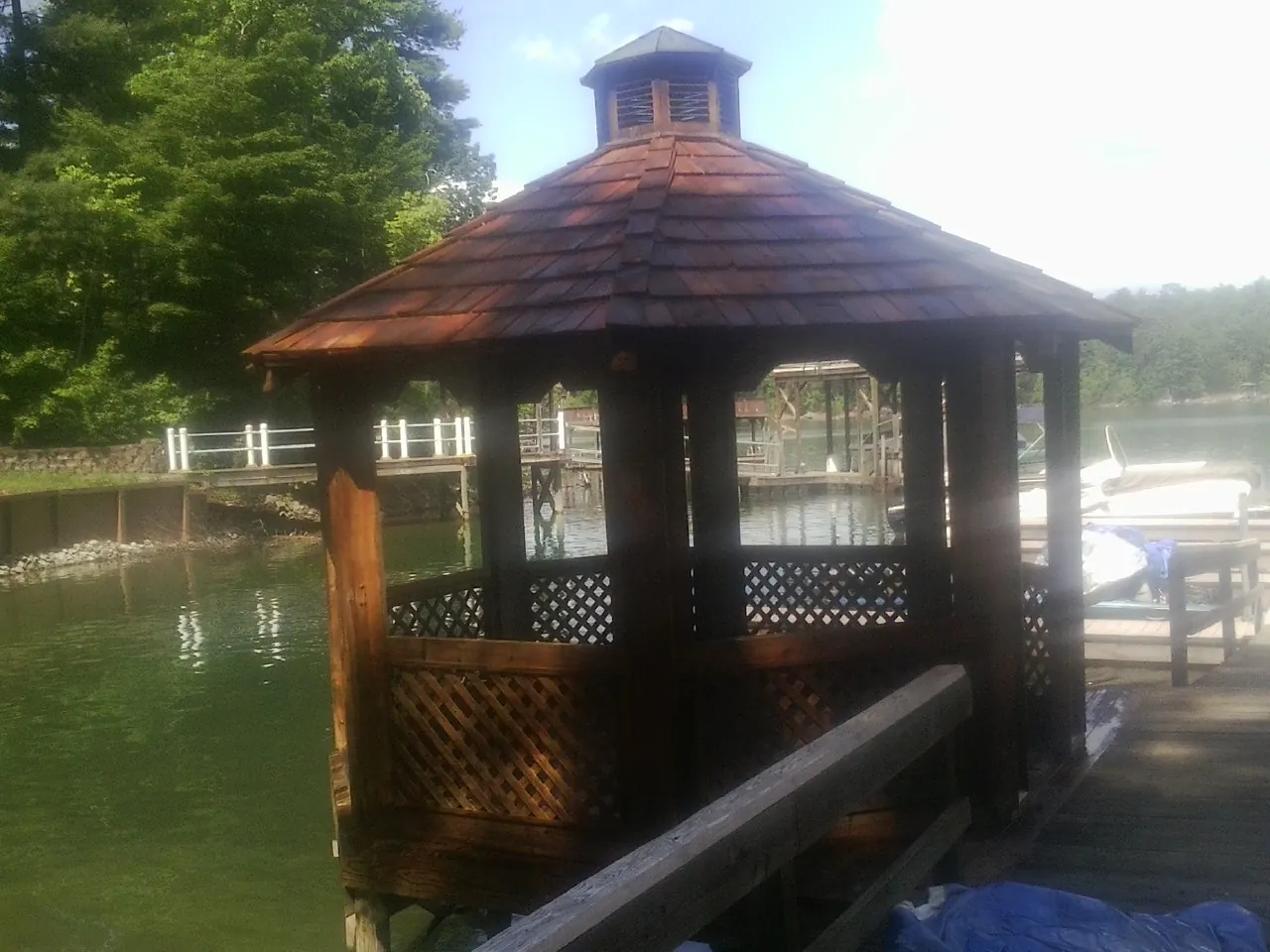 Cedar shake gazebo roof rebuilt on a lake dock in Newport